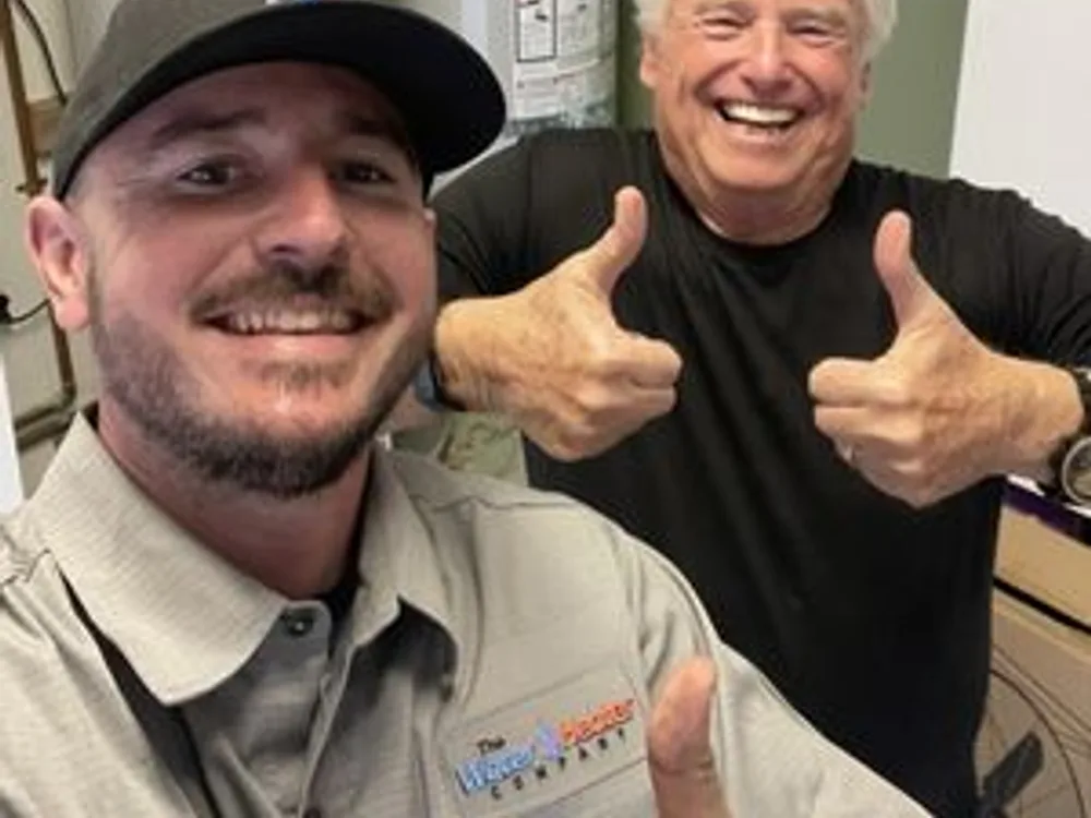 Friendly Front Range plumber explaining a repair to a homeowner
